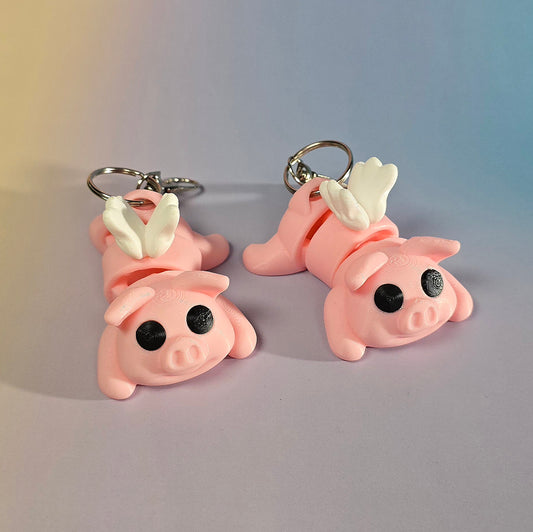 Lidojošā cūciņa atslēgu piekariņš