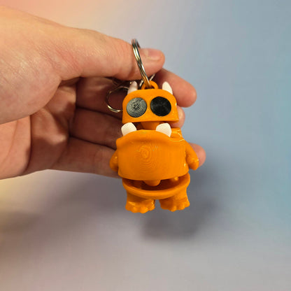 Briesmonīša atslēgu piekariņš